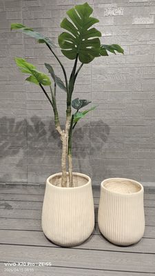 Beli Penampilan Kontemporer Neutral Beige Tekstur Linear Berulang Desain Fiber Clay Planter Bulat online manufacture